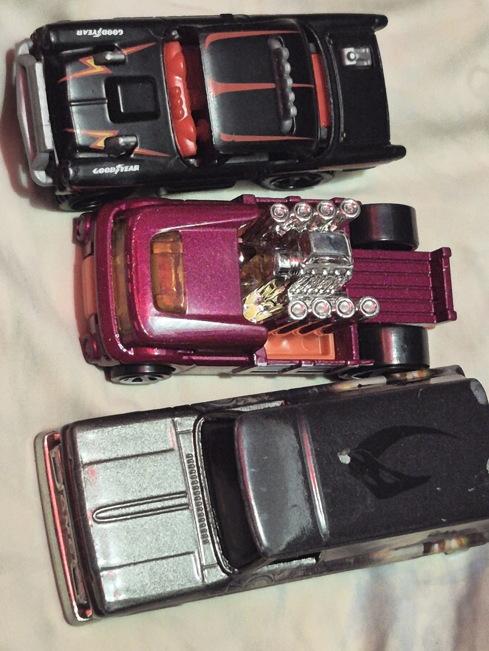 Mattel Black and Metallic Pink Hot Wheels Style Toy Trucks